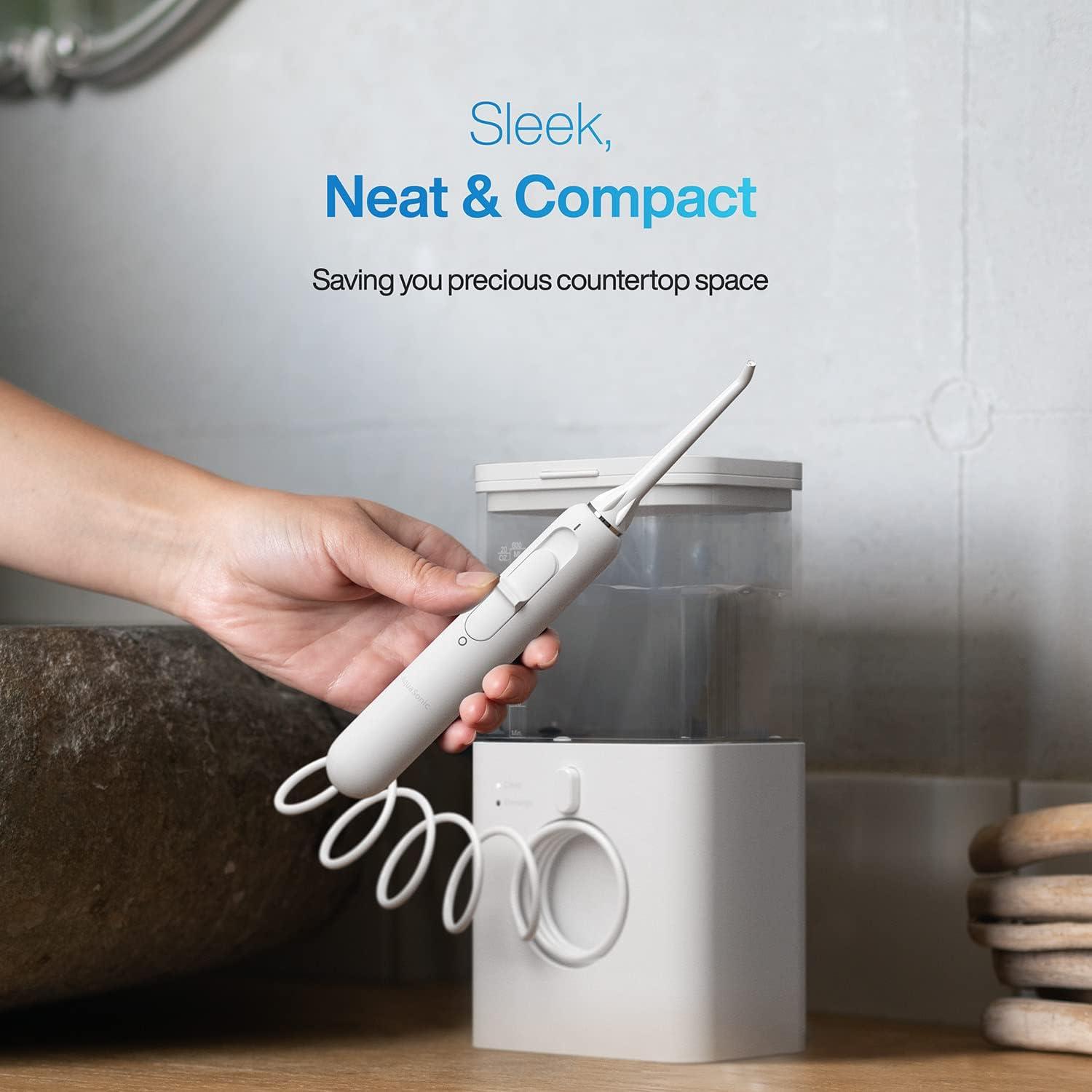 image:imageAquaSonic Aqua Flosser PRO Professional Water Flosser with Large Capacity Reservoir Oral Irrigator w 2 Modes 10 Levels of Water Pressure 4 Included Tips Sleek amp CompactWhite